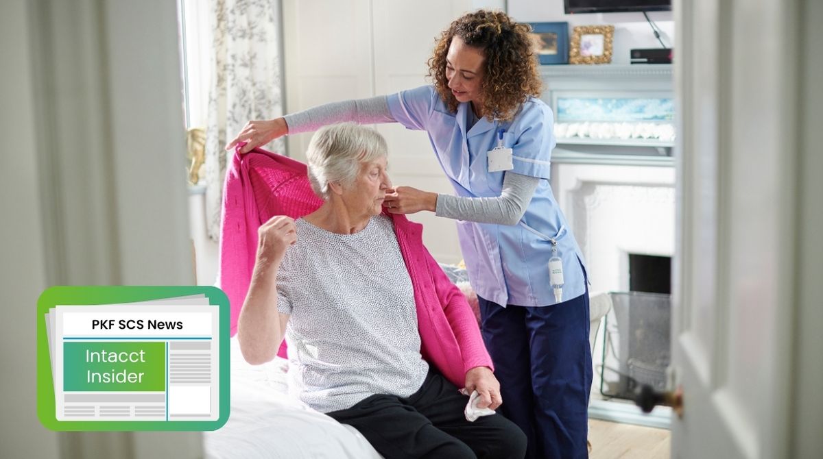Nurse helping care home resident