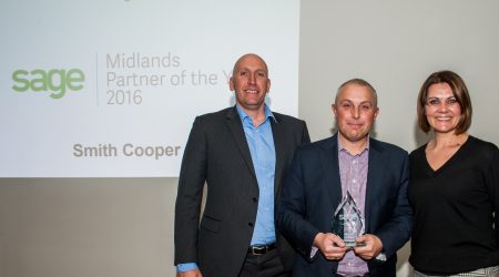 Richard Brewster and Chris Smith receiving award from Nikola McNicol-Kenney VP, New Customer Acquisition UK at Sage UK