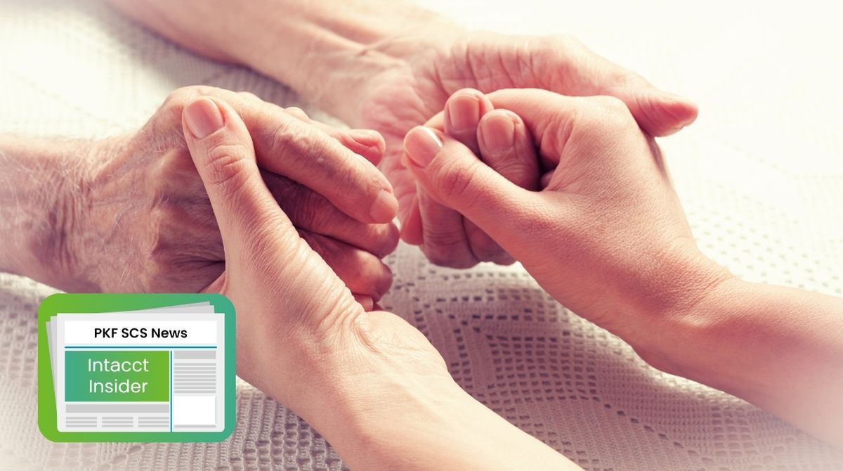 Carer holding elderly resident's hands