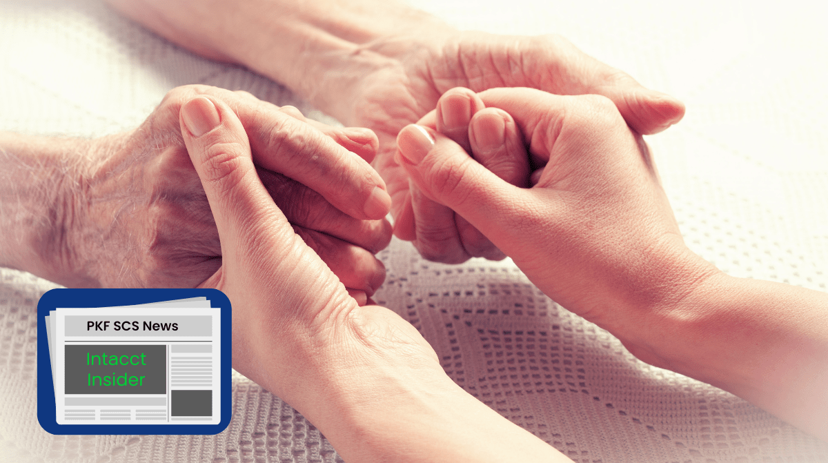 Young person holding hands with elderly person